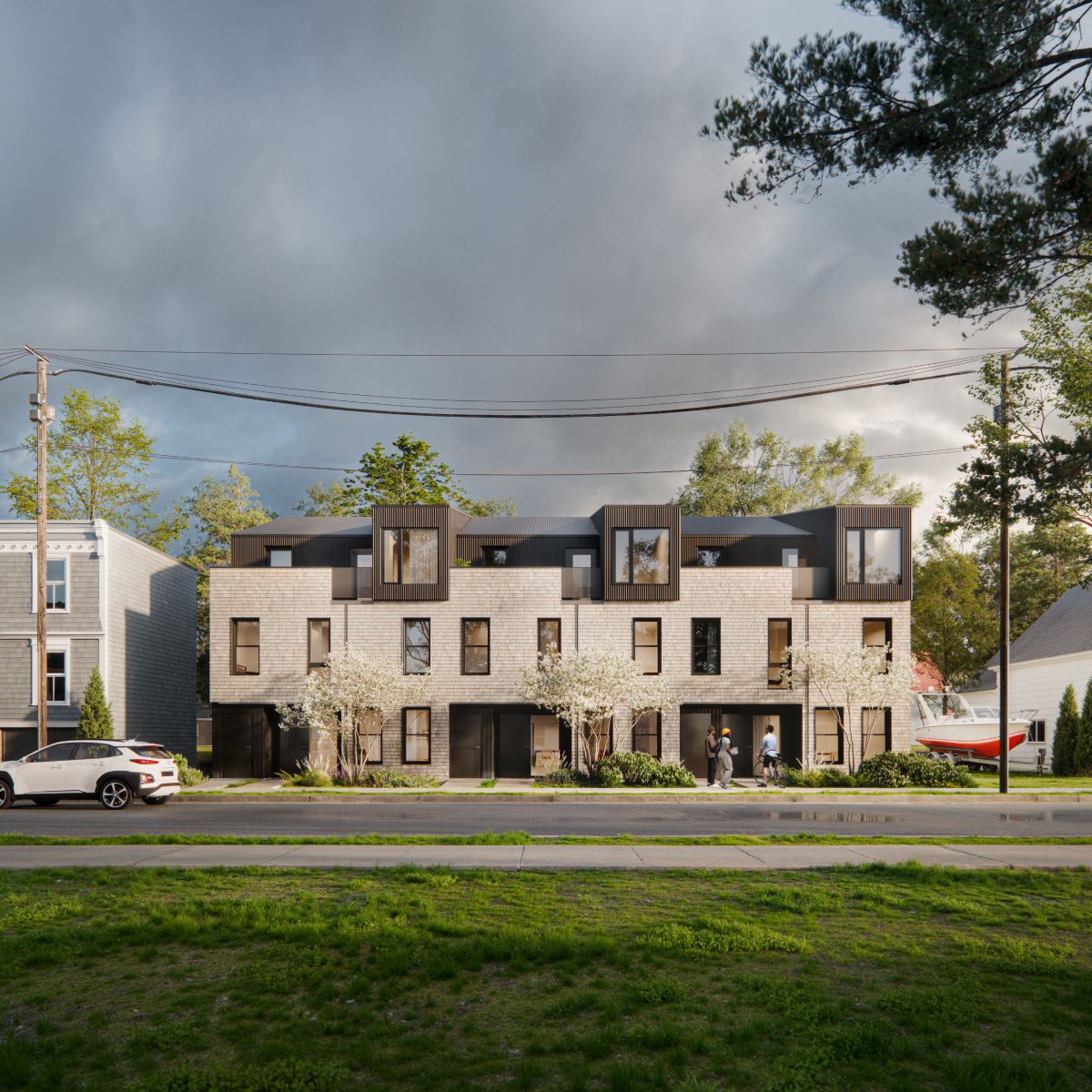 A 3D rendering of a row of townhomes with a mix of light brick and dark metal cladding, set in a neighbourhood with trees. There are residents walking  and going about their day